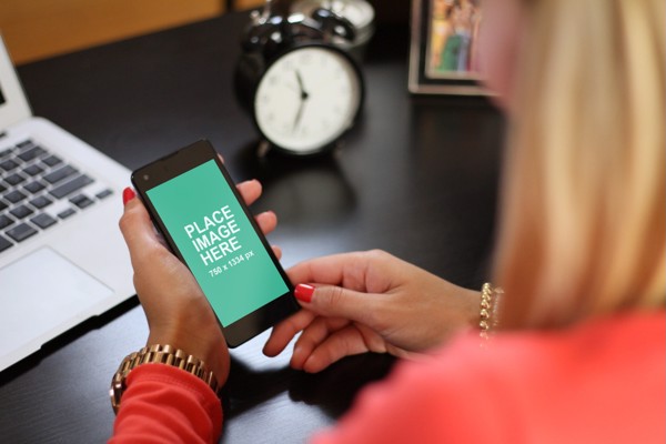 Woman holding generic smartphone