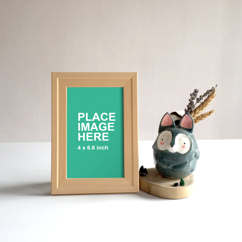 Small wooden frame on table