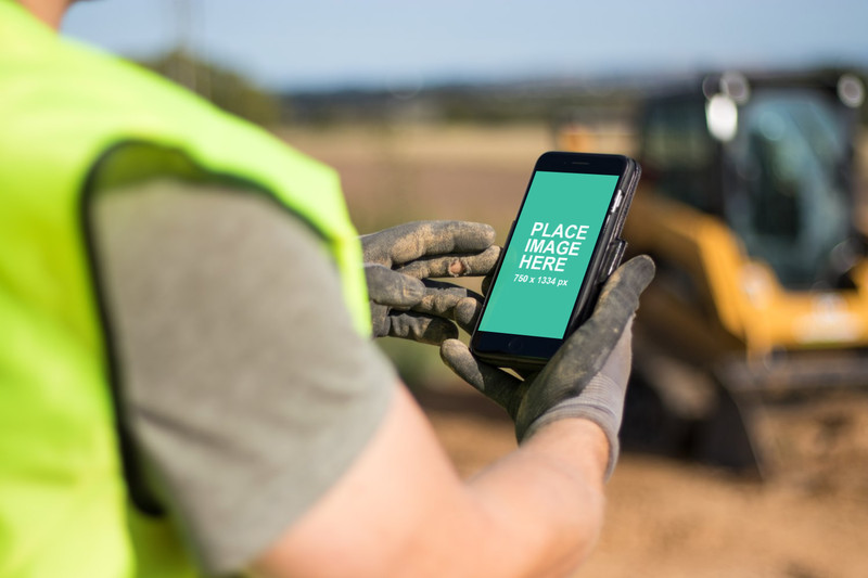 Worker using black iPhone 8