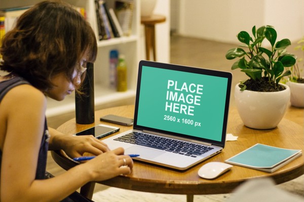 Woman using MacBook Pro