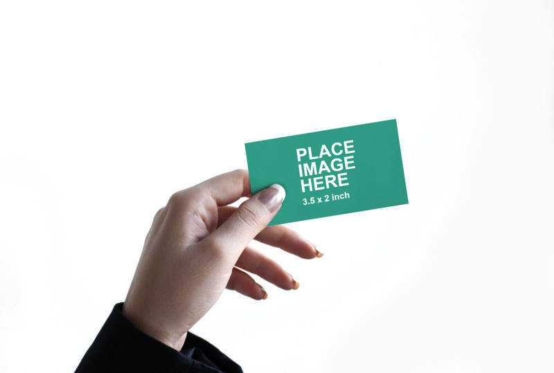 Woman holding business card