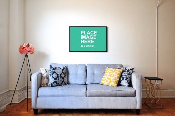 Small frame hanging over sofa