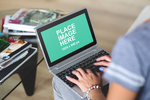 Woman using small laptop