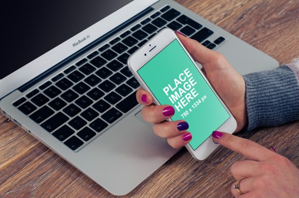Woman using silver iPhone 8