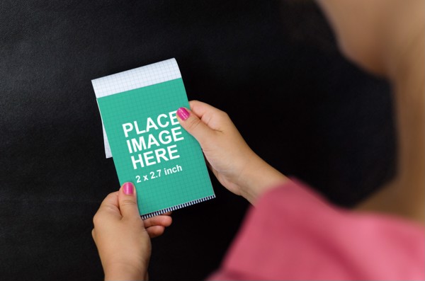 Woman holding piece of paper