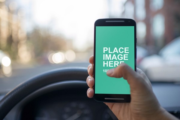 Man using Android device in car