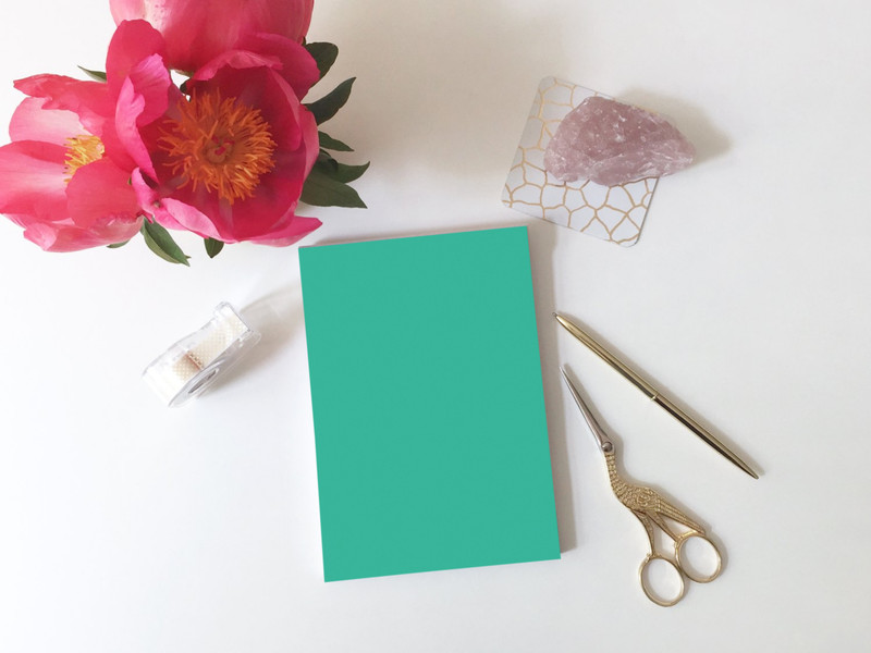A5 notepad on white desk