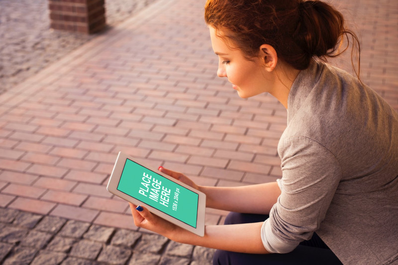 Woman looking at iPad Air
