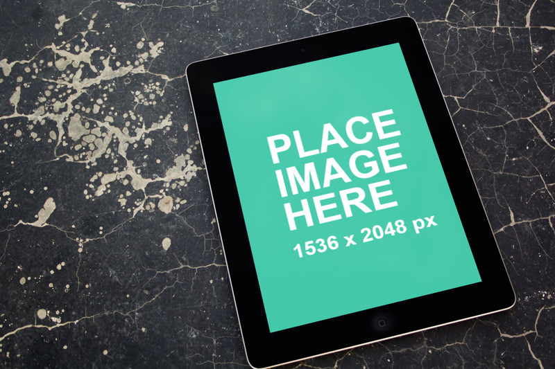 Black iPad 4 on concrete