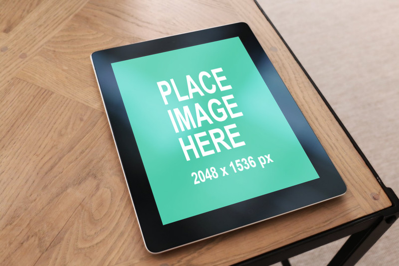 Black iPad 4 on wood table