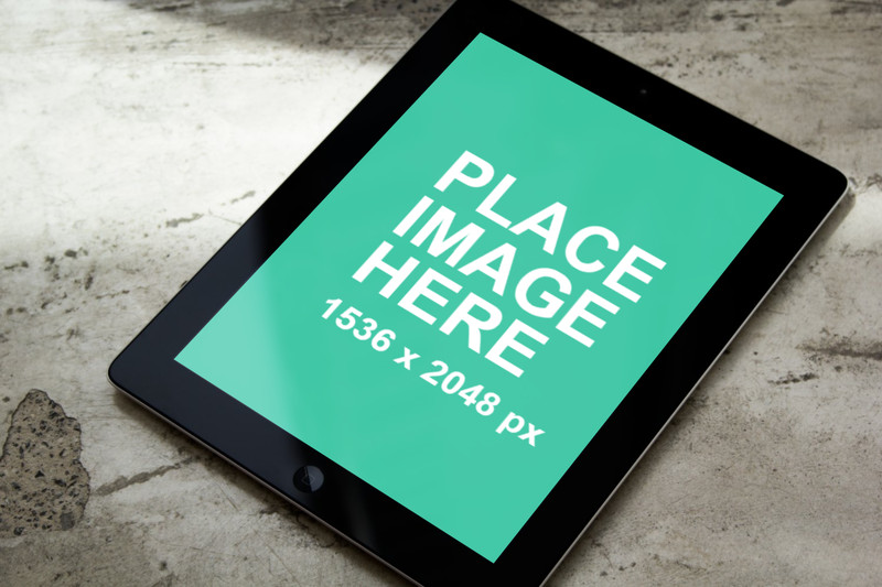 Black iPad on contrete