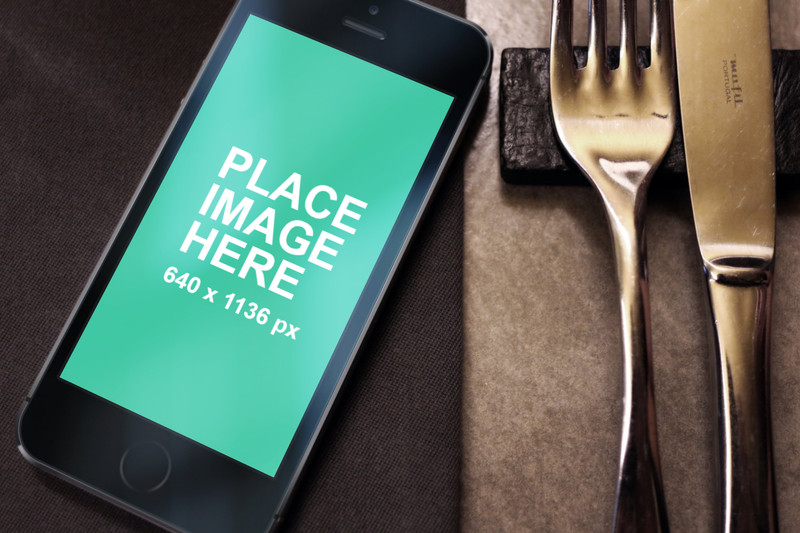 Black iPhone 5s with fork