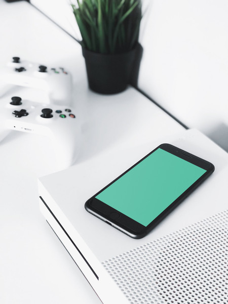 Black iPhone on console