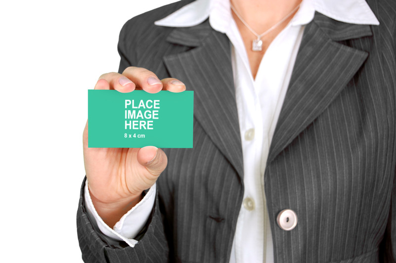Woman holding busines scard