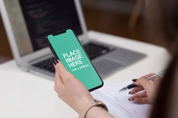 Woman looking at iPhone X