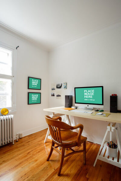 iMac in home office with picture frames