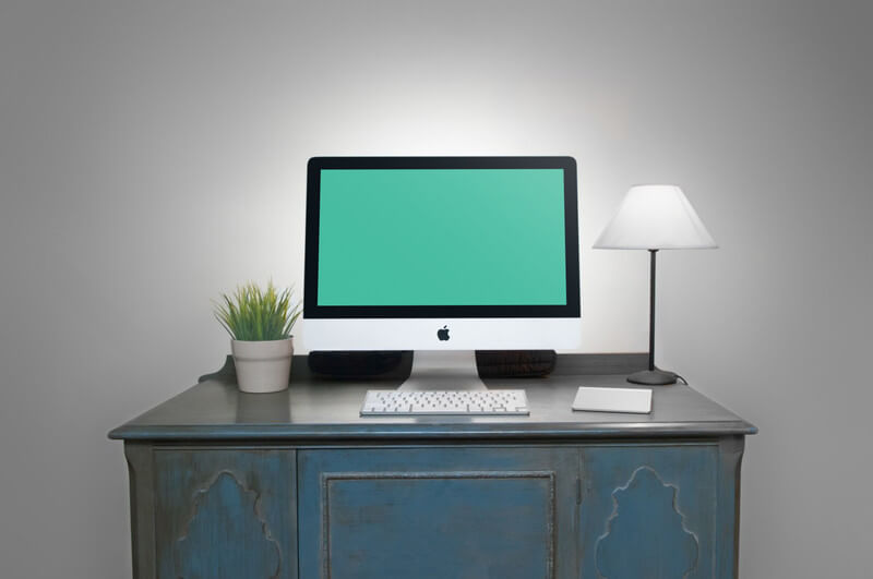 iMac on antique cabinet