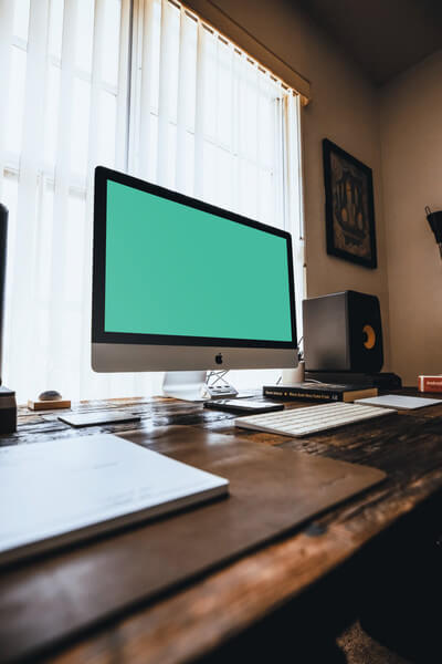 iMac on old wooden desk