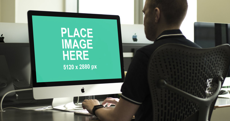 Man working on 5K iMac