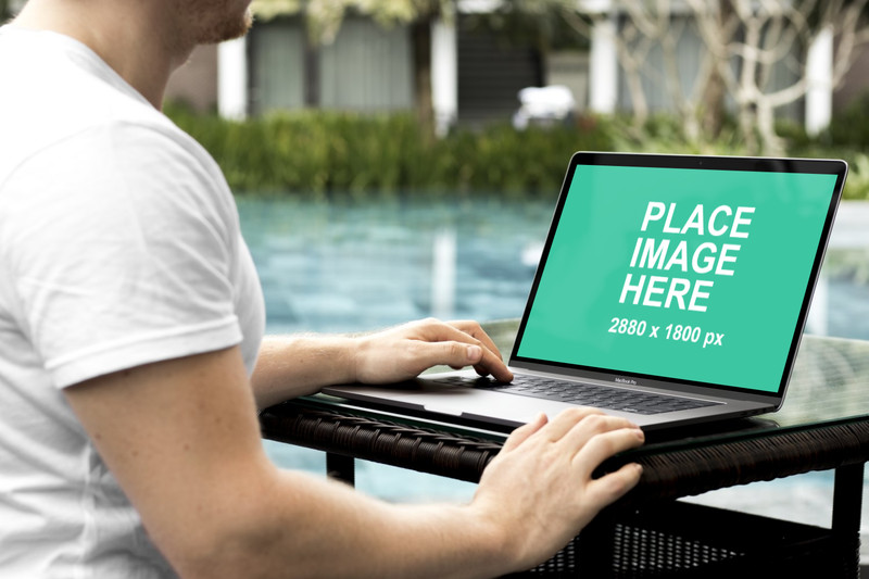 Man using 15 inch Macbook Pro