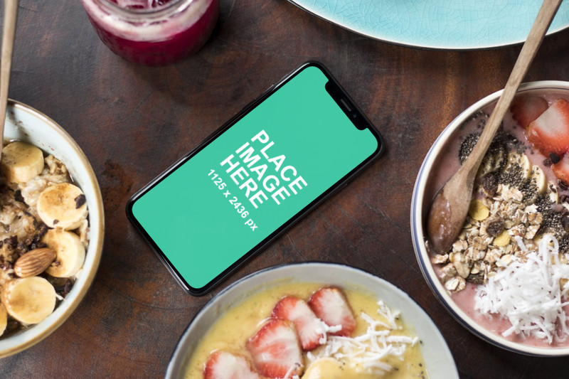 iPhone X with lots of food