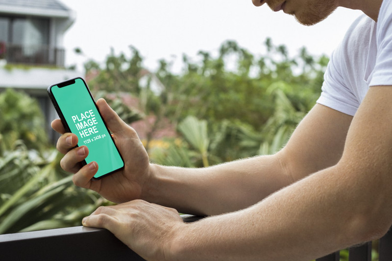 Man looking at iPhone X