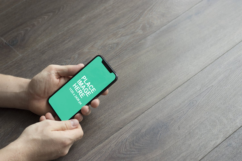 Man holding iPhone X