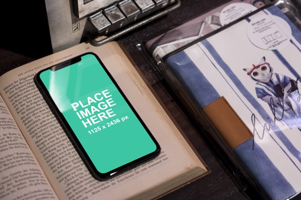 iPhone X on book
