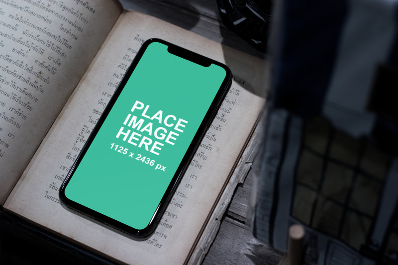 iPhone X on book