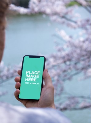 Man holding iPhone X