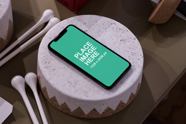iPhone X laying on cake