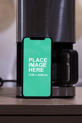 iPhone X with coffee machine