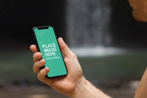 Man looking at iPhone X