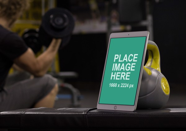 iPad standing up against kettle bell