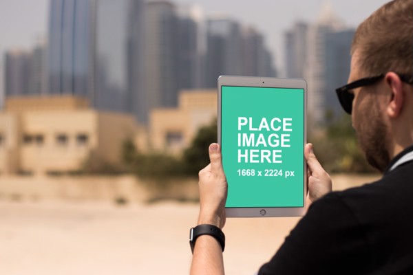 Man holding iPad Pro