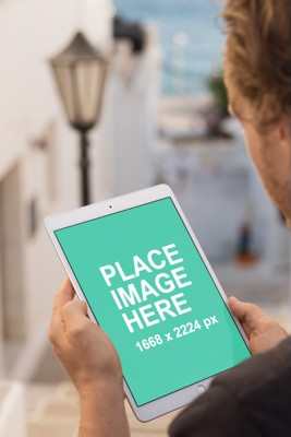 Man holding iPad Pro