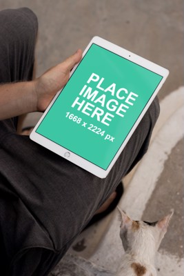 Man holding iPad Pro