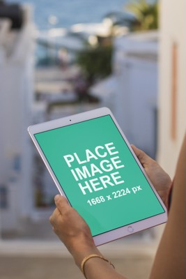 Woman holding iPad Pro