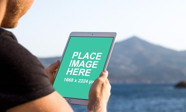 Man holding iPad Pro