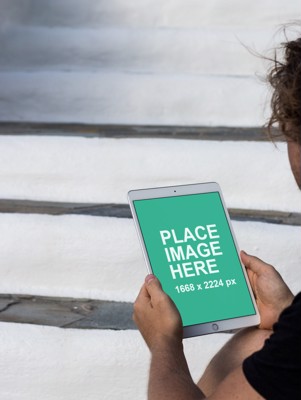 Man holding iPad Pro