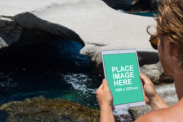 Man holding iPad Pro