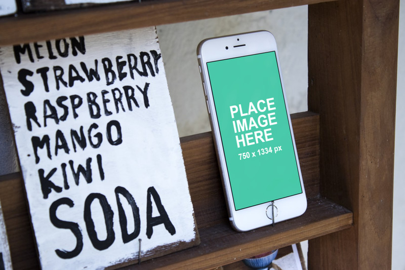 White iPhone 6S with signs