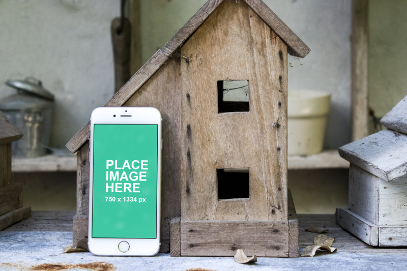White iPhone 6S with wood work