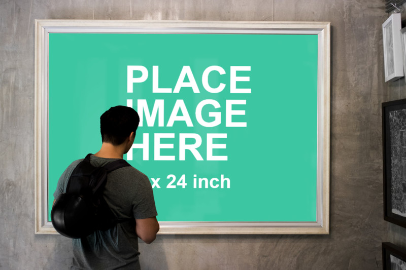 Man looking at huge frame
