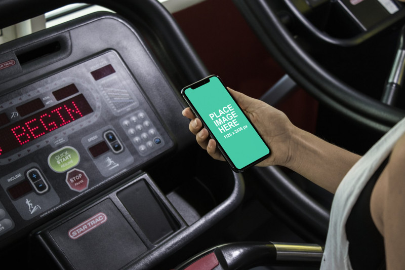 Woman in gym with iPhone X