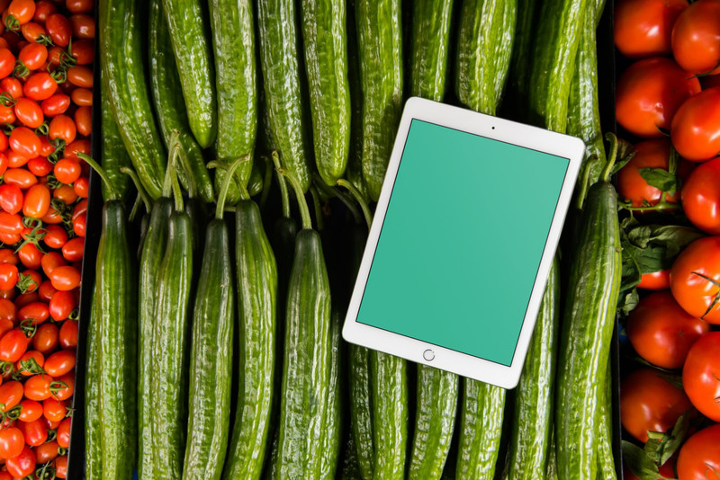 iPad on bed of vegetables