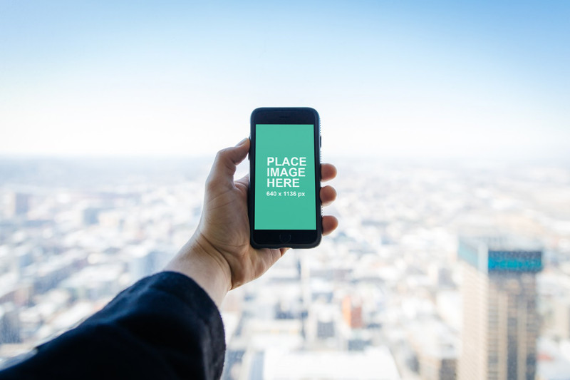 iPhone 5 with city background