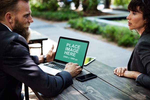 Man and woman with Macbook Pro