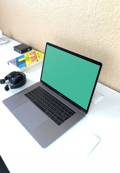 MacBook Pro on white desk