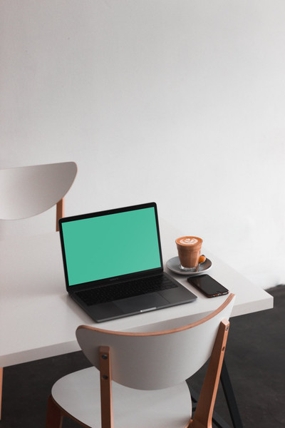 MacBook Pro on white table